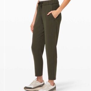 Lululemon On The Fly 7/8 pant -Woven Dark Olive Size 10